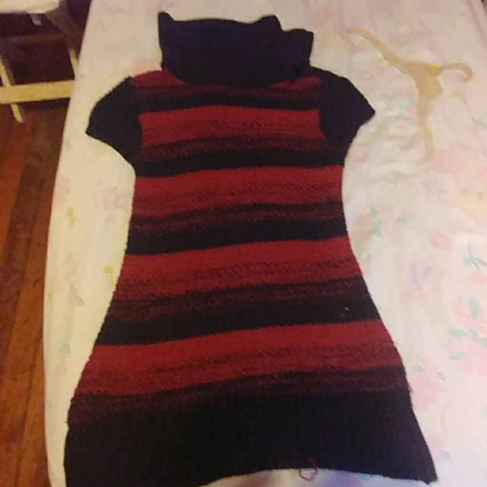 Red and black turtleneck buttons on the turtleneck